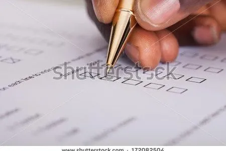 stock-photo-close-up-of-businessman-filling-customer-survey-form-172082504.jpg
