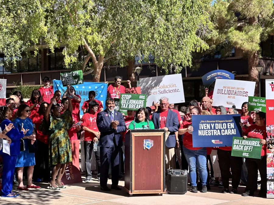 Photo of union members during a press conference in Las Vegas, AFSCME Local 4041 member Rosina Barrientos speaking at a podium