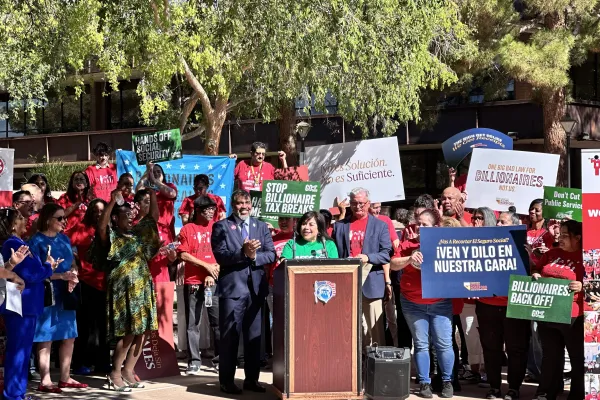 Photo of union members during a press conference in Las Vegas, AFSCME Local 4041 member Rosina Barrientos speaking at a podium
