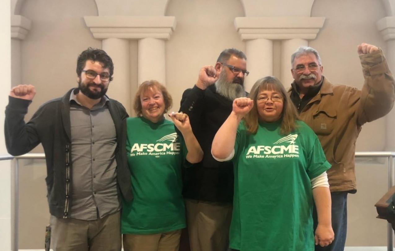AFSCME Local 4041 members after stopping changes to an overtime rule at a personnel commission hearing 